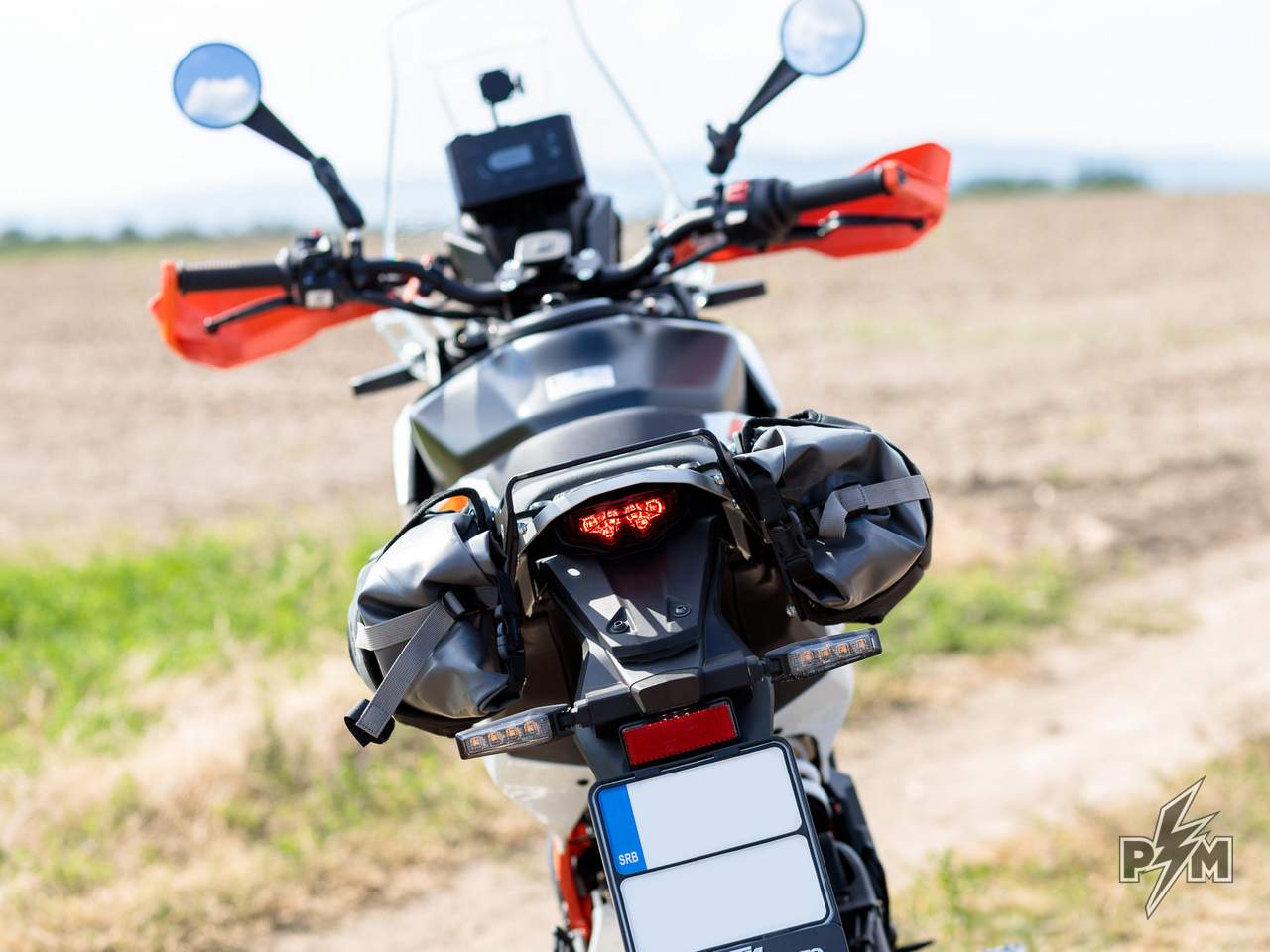 KTM 390 Adventure R or X / Enduro 390 Perun moto AuxPox supports side view with bags installed - test ride rear view